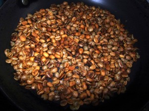 Roasting coffee beans in frying pan