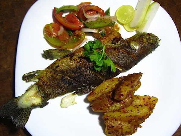 Pan-fried Trout with Potato Wedges and Tomato Salad