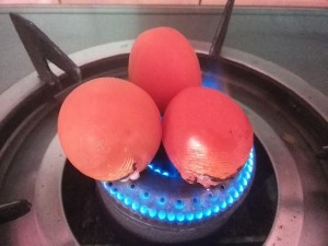 Roasting tomatoes directly over gas flame