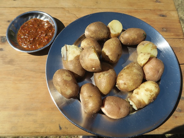 boiled potatoes with chili timur achaar at Kagani